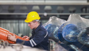 industrial worker inspects pipeline components in 2026 03 17 02 29 58 utc
